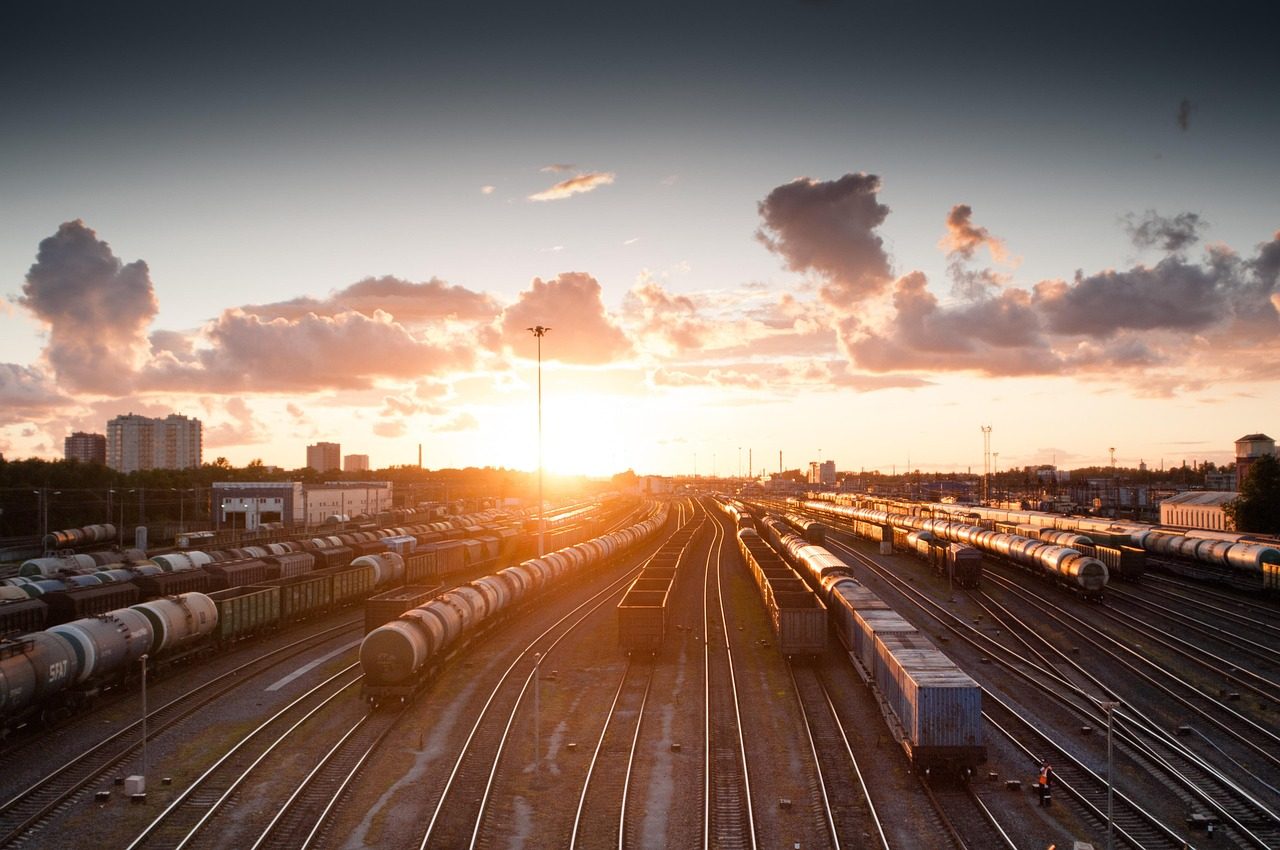 Train, sunset, tracks, railroad, transportation, transport, travel, station, railway, rail, industry, platform, locomotive, traffic, technology, sky, carriage, city, speed, departure, industrial, dusk, wagon, light, transit, modern, urban, nature, street, business, delivery, subway, steel, perspective, motion, building, passenger, journey, logistic